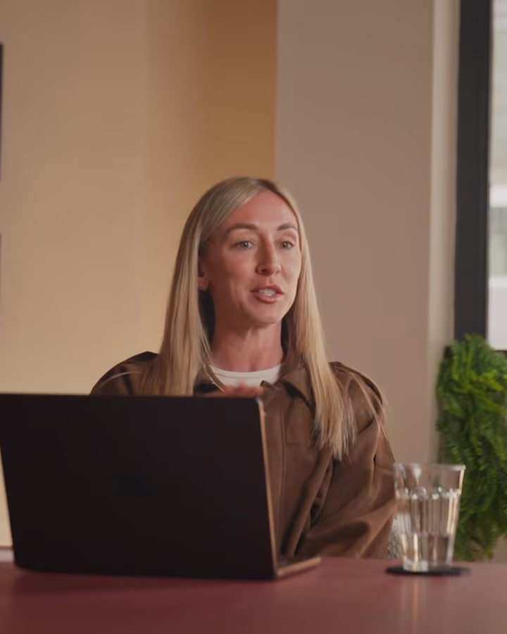 Lydia, Marketing Manager at Harper, at the desk in the Harper office