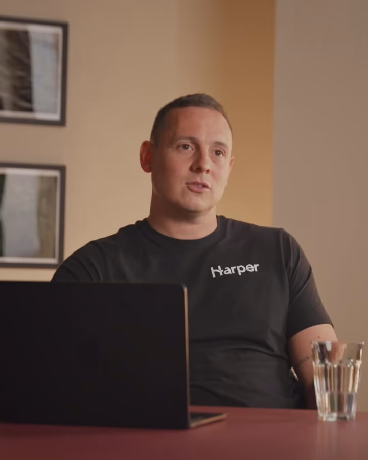 Scott, Sales Director at Harper, at the desk in the Harper office